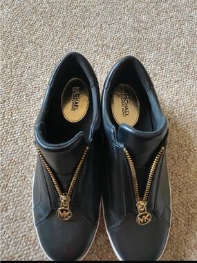 Michael Kors Black Slip-On Sneaker Wedges with Gold Zipper Accents
